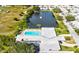 Community overview with pool, pond, and building at 5396 Acacia N Trl, Pinellas Park, FL 33782