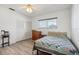 Bright bedroom with double bed and built-in wardrobe at 5396 Acacia N Trl, Pinellas Park, FL 33782