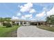 Luxury home with a long paved driveway and attached garage at 5396 Acacia N Trl, Pinellas Park, FL 33782