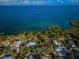 Aerial view of property's waterfront location near other homes at 335 Tucker St, Safety Harbor, FL 34695