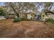 Large backyard with spacious deck and mature trees at 335 Tucker St, Safety Harbor, FL 34695