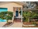 Welcoming front porch with tiled flooring and decorative door at 335 Tucker St, Safety Harbor, FL 34695