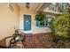 Relaxing front porch with tiled floor and seating area at 335 Tucker St, Safety Harbor, FL 34695