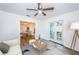 Open living room with view into dining area and access to backyard patio at 335 Tucker St, Safety Harbor, FL 34695