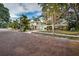 View of two story home and single story home from the street at 335 Tucker St, Safety Harbor, FL 34695