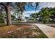 Residential street with mature trees and charming homes at 335 Tucker St, Safety Harbor, FL 34695