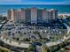 Aerial view of beachfront condo building with ample parking at 880 Mandalay Ave # S507, Clearwater Beach, FL 33767