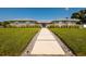 Charming single-story home with concrete walkway, stone accents, and landscaped front yard at 3931 38Th S Way, St Petersburg, FL 33711