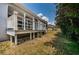 Screened back deck with an exterior view of the yard at 1032 Rosetree Ln, Tarpon Springs, FL 34689