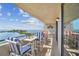 Spacious balcony with water views and outdoor furniture at 6035 Sea Ranch Dr # 505, Hudson, FL 34667