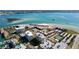 Aerial view showing waterfront community with tennis courts and pool at 830 S Gulfview Blvd # 305, Clearwater Beach, FL 33767