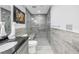 Updated bathroom with walk-in shower and built-in bench at 10073 S Yacht Club Dr, Treasure Island, FL 33706