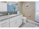 Bathroom with white vanity and granite countertop at 10073 S Yacht Club Dr, Treasure Island, FL 33706