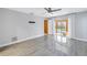 Bedroom with sliding glass doors leading to the backyard at 10073 S Yacht Club Dr, Treasure Island, FL 33706