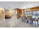 Elegant dining area with spiral staircase and view of backyard pool at 10073 S Yacht Club Dr, Treasure Island, FL 33706