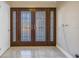 Elegant entryway with double doors and tiled floors at 10073 S Yacht Club Dr, Treasure Island, FL 33706