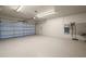 Attached garage with light colored flooring at 10073 S Yacht Club Dr, Treasure Island, FL 33706