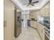 Modern kitchen with stainless steel appliances and light colored cabinets at 10073 S Yacht Club Dr, Treasure Island, FL 33706