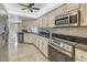 Modern kitchen with stainless steel appliances and granite countertops at 10073 S Yacht Club Dr, Treasure Island, FL 33706