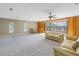 Living room features wood walls and access to deck at 10073 S Yacht Club Dr, Treasure Island, FL 33706