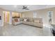 Relaxing living room with a large sectional sofa and plenty of natural light at 10073 S Yacht Club Dr, Treasure Island, FL 33706