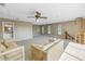 Large living room with beige carpet and access to deck at 10073 S Yacht Club Dr, Treasure Island, FL 33706