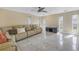 Spacious living room featuring a large sectional sofa and tile floors at 10073 S Yacht Club Dr, Treasure Island, FL 33706