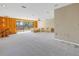 Spacious living area with wood-paneled walls and deck access at 10073 S Yacht Club Dr, Treasure Island, FL 33706