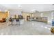Open concept living room with a kitchen island and beige sectional sofa at 10073 S Yacht Club Dr, Treasure Island, FL 33706