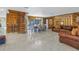 Open living space with spiral staircase and leather sofa at 10073 S Yacht Club Dr, Treasure Island, FL 33706
