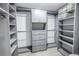 Large walk-in closet with ample shelving and hanging space at 10073 S Yacht Club Dr, Treasure Island, FL 33706