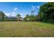 Large backyard with grassy area and bird bath at 1493 Eagle St, Port Charlotte, FL 33952