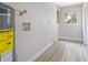 Bright laundry room with vinyl flooring, water heater, and window at 1493 Eagle St, Port Charlotte, FL 33952