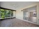 Screened porch with view of backyard and living room at 1493 Eagle St, Port Charlotte, FL 33952