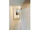 Bright hallway with light colored carpet leading to living area at 2220 Spanish Dr # 36, Clearwater, FL 33763