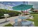 Community grills and picnic tables for outdoor dining at 8001 Sailboat Key S Blvd # 204, St Pete Beach, FL 33707