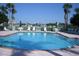 Inviting community pool with ample lounge chairs at 8001 Sailboat Key S Blvd # 204, St Pete Beach, FL 33707