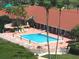 Resort-style pool with lounge chairs, and surrounding recreational areas at 8001 Sailboat Key S Blvd # 204, St Pete Beach, FL 33707