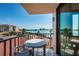 Private balcony with table and chairs overlooking the water at 6268 Palma Del Mar S Blvd # 406, St Petersburg, FL 33715