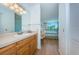 Bathroom with vanity and view into bedroom at 6268 Palma Del Mar S Blvd # 406, St Petersburg, FL 33715