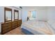 Bedroom with twin bed, dresser and water view at 6268 Palma Del Mar S Blvd # 406, St Petersburg, FL 33715