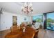 Dining area with wooden table and chairs near living room at 6268 Palma Del Mar S Blvd # 406, St Petersburg, FL 33715