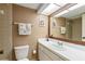 Bathroom with toilet, sink, and vanity at 830 S Gulfview Blvd # 102, Clearwater, FL 33767