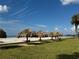 Beachfront property with thatched cabanas and picnic tables at 1460 Gulf Blvd # 1212, Clearwater Beach, FL 33767