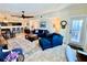 Bright and airy living room with comfortable seating, open to the kitchen and balcony at 1460 Gulf Blvd # 1212, Clearwater Beach, FL 33767