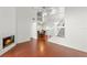 Open dining room with wood-look tile floors and a view of the staircase at 3051 Overlook Pl, Clearwater, FL 33760