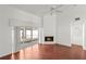 Bright Gathering room with fireplace, sliding glass doors, and wood-look tile floors at 3051 Overlook Pl, Clearwater, FL 33760