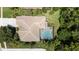 An aerial shot of a house with a pool and a large backyard at 4995 Quill Ct, Palm Harbor, FL 34685