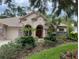 Beautiful two-story house with landscaping and stone accents at 4995 Quill Ct, Palm Harbor, FL 34685