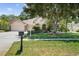 Stunning curb appeal with lush landscaping and a welcoming entrance at 4995 Quill Ct, Palm Harbor, FL 34685